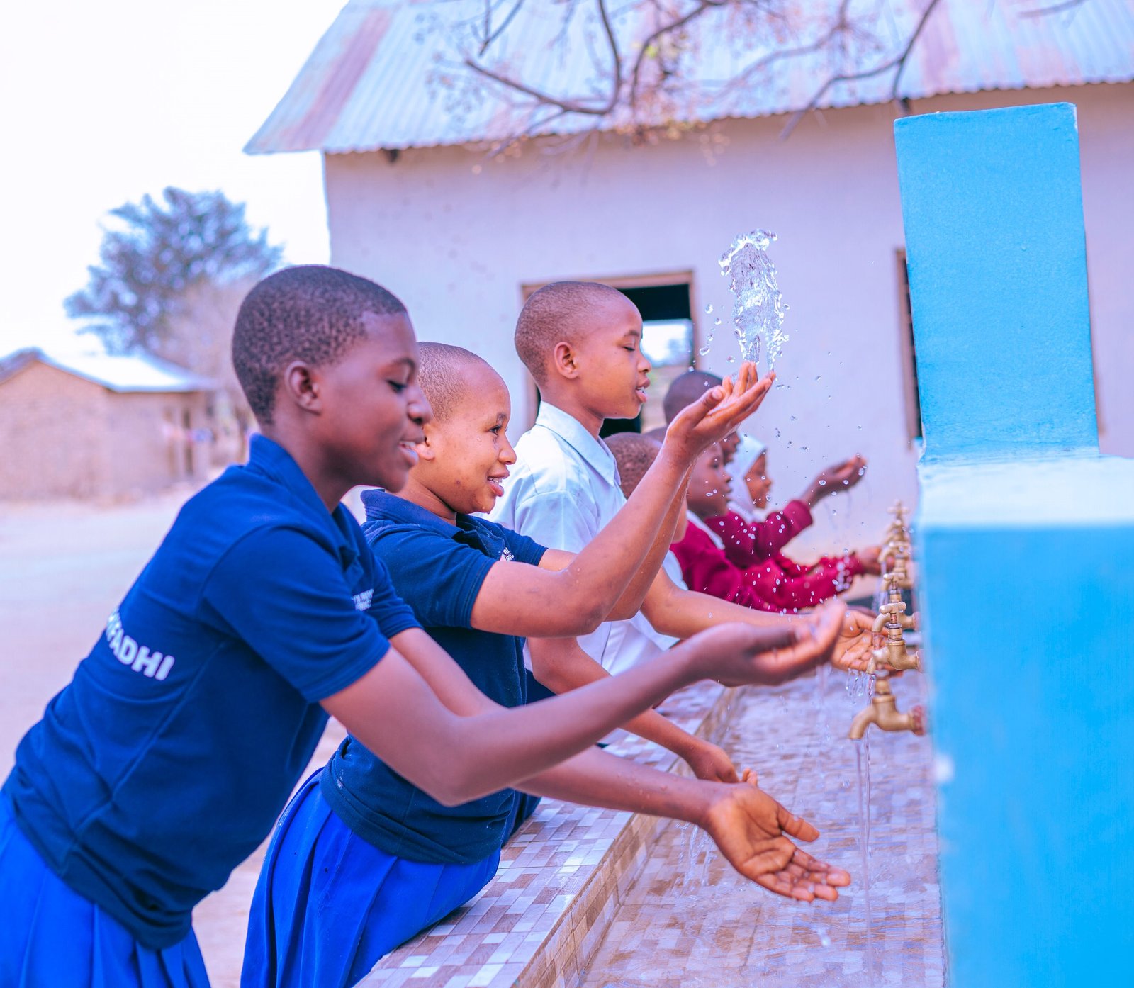 Girls in washing their hands